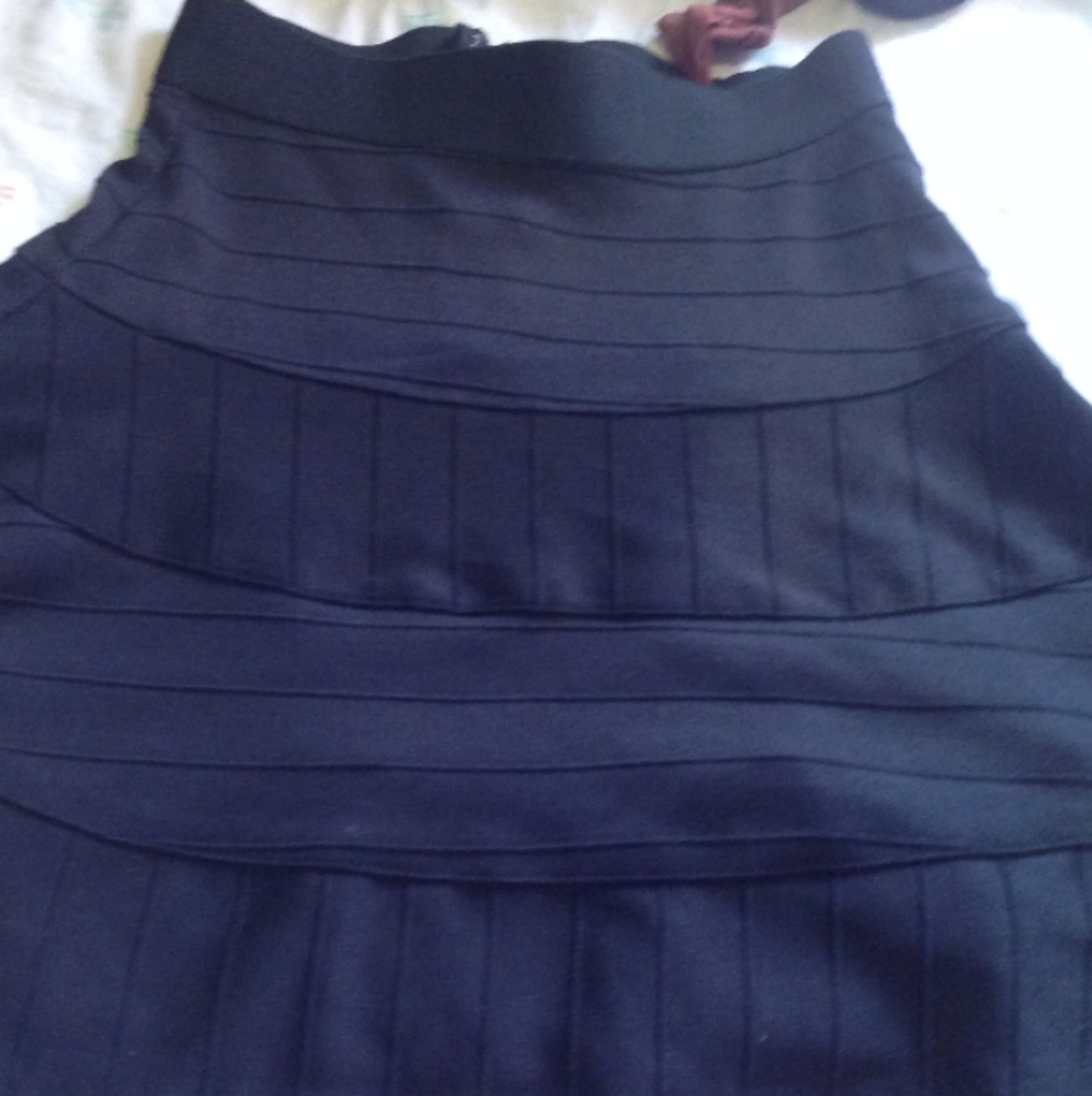 Black textured mini skirt.